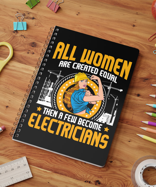 Notebook with an electrician graphic and text on a wooden surface with stationery items.
