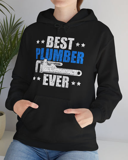 Person wearing a black hoodie with 'Best Plumber Ever' text and graphic, standing indoors.