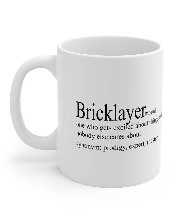 White mug with black text definition of a 'Bricklayer' on a white background