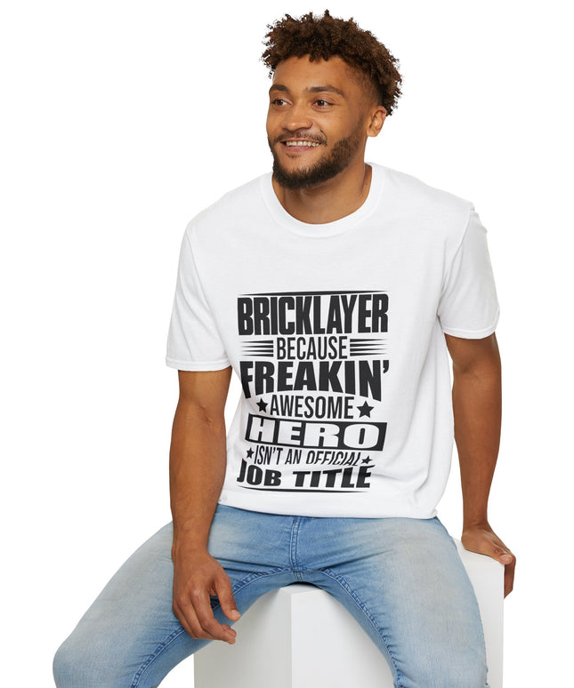 Man wearing a white t-shirt with text sitting on a white stool against a white background
