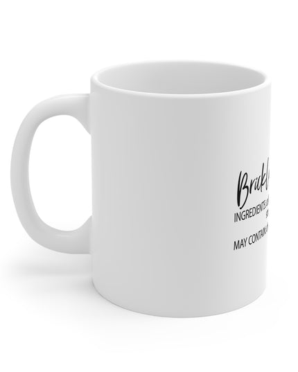White mug with black text on a white background