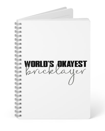 Notebook with 'World's Okayest Bricklayer' text on a white background