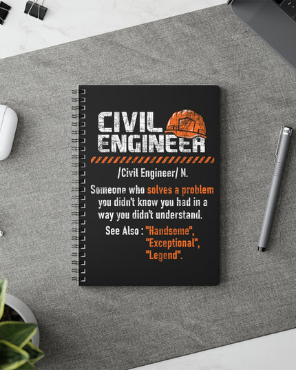 Notebook with 'Civil Engineer' definition on a desk with a pen and earbuds.