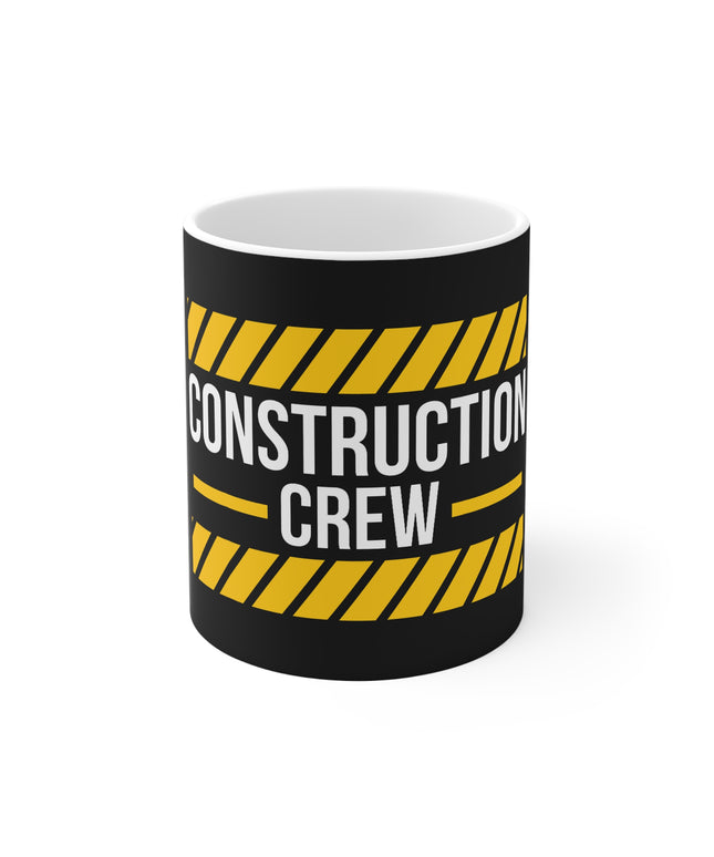 Mug with 'Construction Crew' text and yellow hazard stripes on a black background