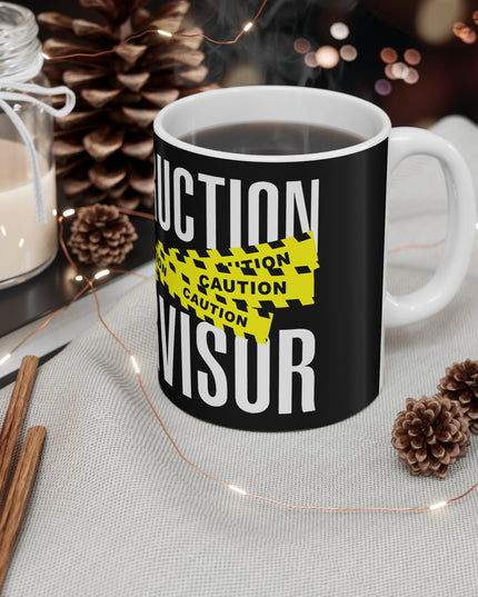 Black mug with 'CONSTRUCTION SUPERVISOR' text on a table with decorative items