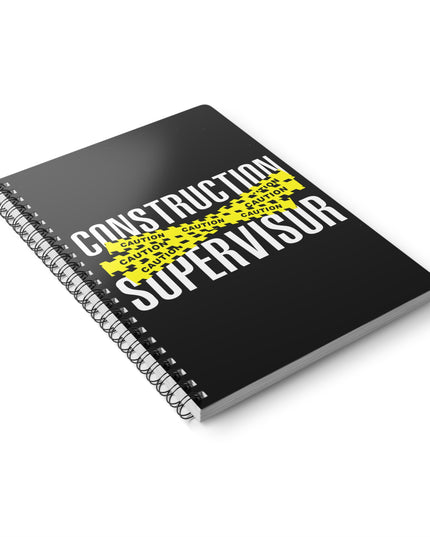 Black notebook with 'Construction Supervisor' text and yellow warning stripes on a white background