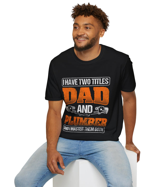 Man wearing a black t-shirt with text 'I have two titles Dad and Plumber and I master them both' on a white background