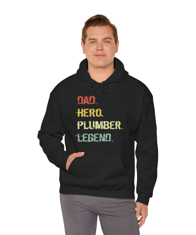 Man wearing a black hoodie with text 'Dad. Hero. Plumber. Legend.' on a white background
