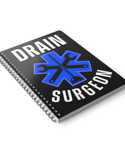 Notebook with 'Drain Surgeon' design on a white background