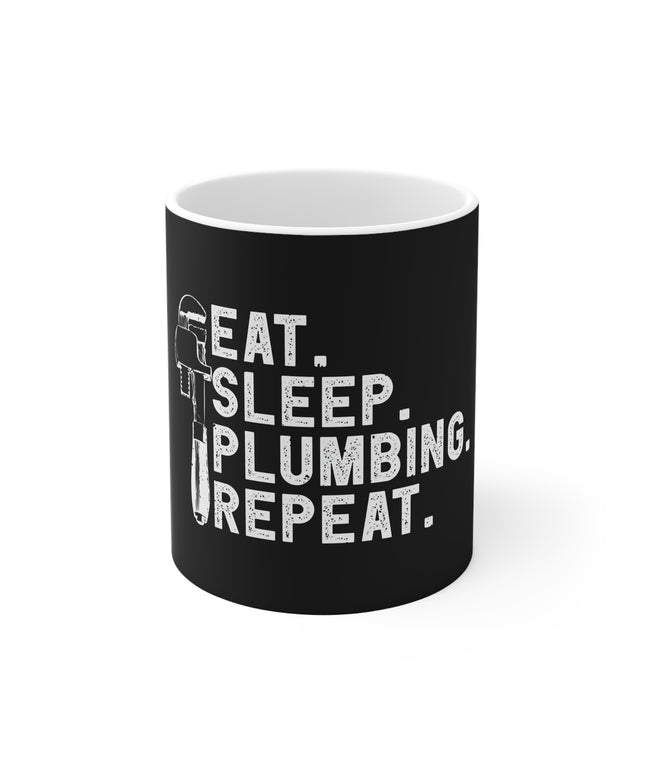 White mug with black print and white text " Eat. Sleep. Plumbing. Repeat." on a white background