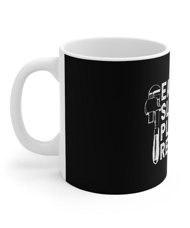 White mug with black print and white text " Eat. Sleep. Plumbing. Repeat." on a white background