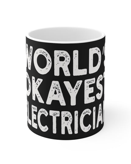 Black mug with white text 'World Okayest Electrician' on a white background