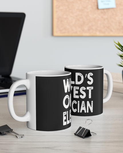 Two black mugs with white text on a desk with office supplies and a plant.
