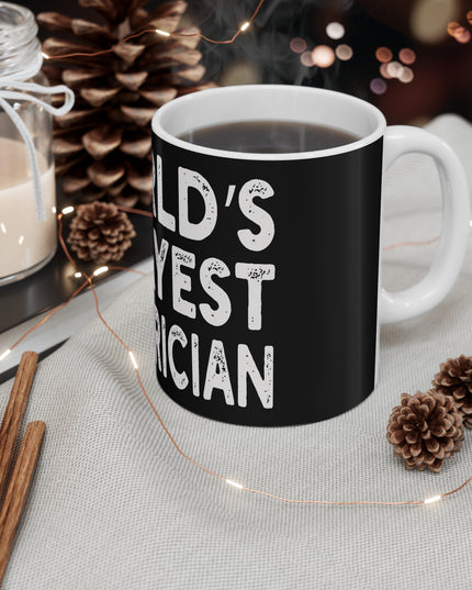 Black mug with 'World's Okayest Electrician' text on a table with decorative items