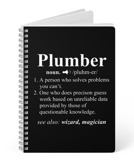 Black notebook with white text definition of a plumber on a white background
