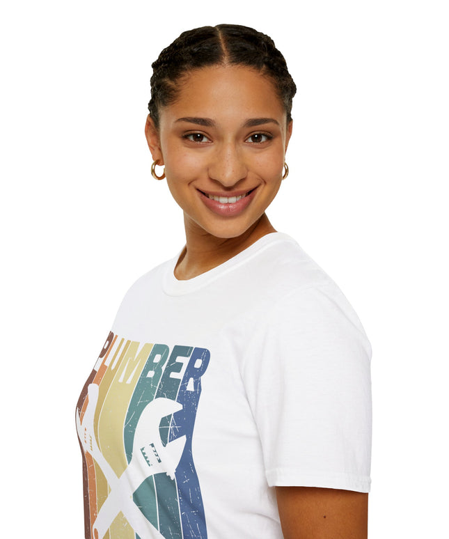 Woman wearing white t-shirt with plumber tools, text, and a rainbow graphic on a white background